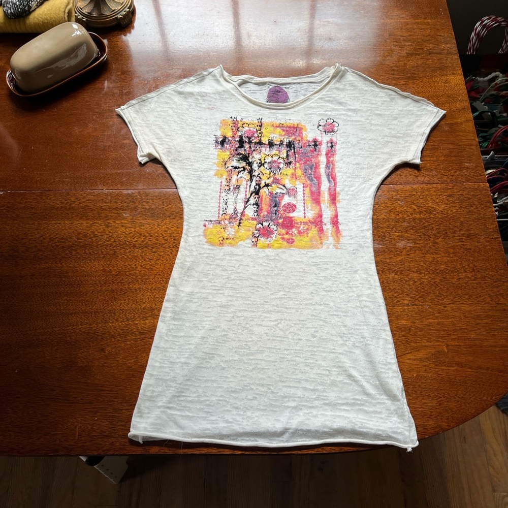 Free People Vintage cream with yellow and purple graphics.